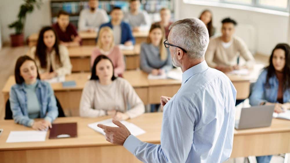 public speaking teacher at front of class